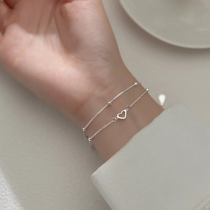 Pulsera con dije de corazón doble en plata de ley 925: joyería elegante y romántica para mujeres