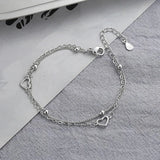 Pulsera con dije de corazón doble en plata de ley 925: joyería elegante y romántica para mujeres