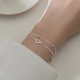 Pulsera con dije de corazón doble en plata de ley 925: joyería elegante y romántica para mujeres