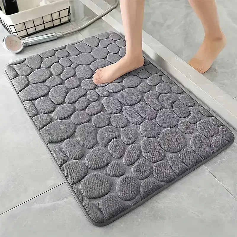Alfombrilla de baño antideslizante 3D con relieve de adoquines y absorbente de secado rápido