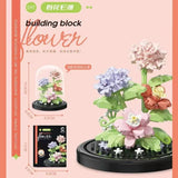 Juego de bloques de construcción con rosas y suculentas en macetas: decoración del hogar con flores eternas
