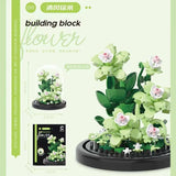 Juego de bloques de construcción con rosas y suculentas en macetas: decoración del hogar con flores eternas