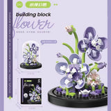 Juego de bloques de construcción con rosas y suculentas en macetas: decoración del hogar con flores eternas