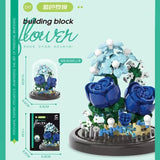 Juego de bloques de construcción con rosas y suculentas en macetas: decoración del hogar con flores eternas