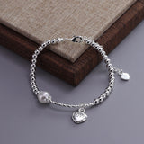 Pulsera con dije de corazón doble en plata de ley 925: joyería elegante y romántica para mujeres
