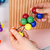Pelota elástica de cuentas de colores para apretar: juguete antiestrés para niños y adultos