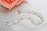 Pulsera con dijes en plata de ley 925: joyas elegantes y atemporales para mujeres