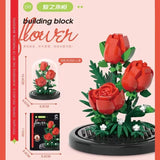 Juego de bloques de construcción con rosas y suculentas en macetas: decoración del hogar con flores eternas