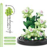 Juego de bloques de construcción con rosas y suculentas en macetas: decoración del hogar con flores eternas