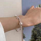 Pulsera con dije de corazón vintage en plata de ley 925: joyería elegante y atemporal para mujeres