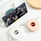 Carrete de almacenamiento de cables compacto: organizador giratorio para cables USB, de auriculares y de carga