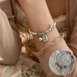 Pulsera con dije de corazón vintage en plata de ley 925: joyería elegante y atemporal para mujeres