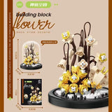 Juego de bloques de construcción con rosas y suculentas en macetas: decoración del hogar con flores eternas