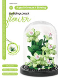 Juego de bloques de construcción con rosas y suculentas en macetas: decoración del hogar con flores eternas