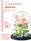 Juego de bloques de construcción con rosas y suculentas en macetas: decoración del hogar con flores eternas