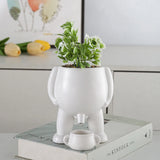 Funny Ceramic Peeing Planter with Artificial Plant for Desktop Decoration